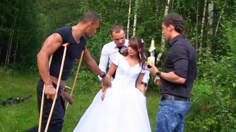 Wearing her wedding dress while having a group party